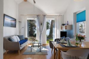 a living room with a couch and a table at Ferienhaus Gerster in Mitten