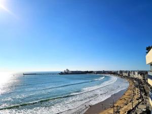 a view of the beach from the balcony of a condo at La Houle, appartement face mer in Les Sables-d'Olonne