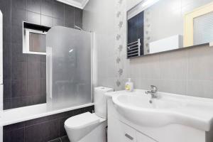 a white bathroom with a sink and a toilet at Casinha Da Aldeia in Cela Velha +15 photos