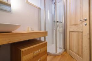 a bathroom with a shower and a sink at Casa Pollicina in Margno +25 photos