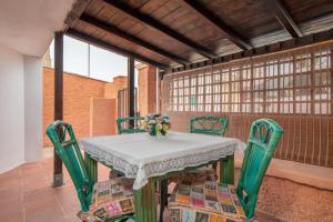 a table and chairs on a patio with a table at Casa Bice 2 in Golfo Aranci