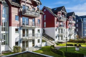 a row of colorful houses in a city at Ferienwohnung Tannenblick 3-3 in Oberhof