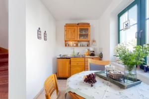 a kitchen with a table and a counter top at Gästehaus Knuth Zinnowitz in Zinnowitz