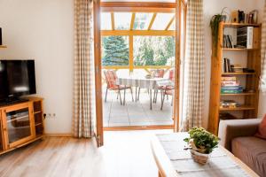 a living room with a couch and a table at Wellehof in Oberkirch