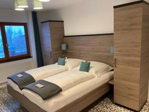 a bedroom with a large bed with a wooden headboard at Casa Rural in Nerenstetten