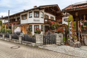 a house with a fence in front of it at Haus Verena Mittenwald in Mittenwald