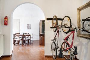 two bikes hanging on a wall in a room at Casa Leah in Imperia