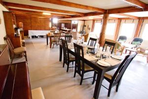 a dining room with a long table and chairs at Agama Tented Camp in Garies