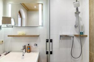 a bathroom with a sink and a shower at Haus Verena Mittenwald in Mittenwald +61 photos