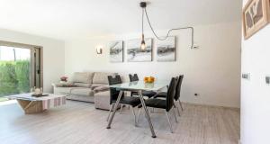 a living room with a table and a couch at Francisca in Pollença