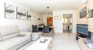 a living room with a couch and a table at Francisca in Pollença
