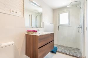 a bathroom with a sink and a shower at The Olives in Port de Soller +17 photos