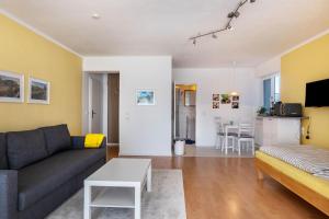 a living room with a couch and a table at Kocher und Jagst in Michelbach an der Bilz