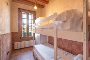 a room with two bunk beds in a room at Masia Can Divi in La Ametlla +35 photos