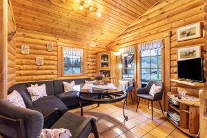 a living room with a couch and a table at Ferienhaus Hohlwegstübchen in Sundern