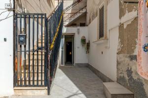 an entrance to a building with an iron gate at Sg Apartment Standard Plus in Massafra