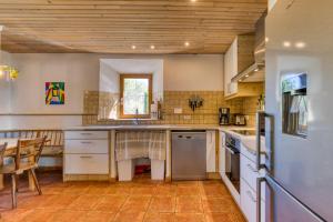 a kitchen with a sink and a table in it at Maison Citron in Aspiran