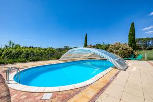 a swimming pool with a glass bridge over it at Maison Citron in Aspiran