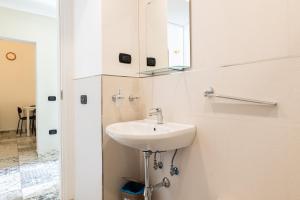 a bathroom with a sink and a mirror on the wall at Sg Apartment Standard Plus in Massafra +14 photos