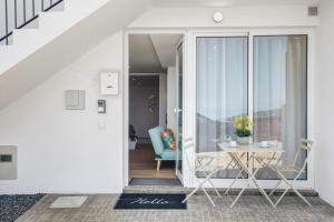 a room with a table and a glass door at Studio Casa Belavista in Gaula