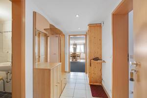 a kitchen with a sink and a counter in a room at Petrushof Ferienwohnung Taubensee in Oberwössen +21 photos