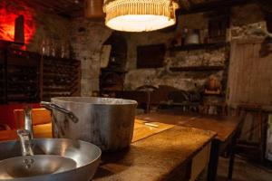 a pot sitting on a counter next to a sink at Beb 1416 in Anghiari +41 photos
