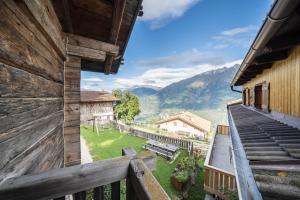 a view from the balcony of a house with a view at Thaler-hof Ferienhaus Lärchnhittl in Lagundo