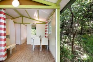 an internal view of a house with a table and chairs at chalet nel bosco in Casarza Ligure +22 photos