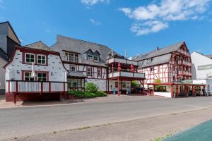 a large building on the side of a street at Fewo Moseljuwel mit Sauna und Pool in Traben-Trarbach