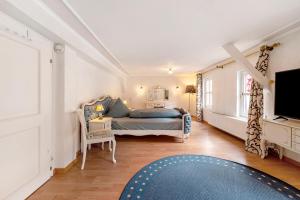 a bedroom with a bed and a tv at Fewo Moseljuwel mit Sauna und Pool in Traben-Trarbach