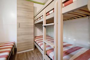 a bunk bed room with two bunk beds at chalet nel bosco in Casarza Ligure