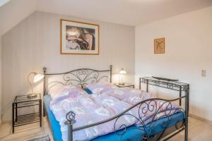 a bedroom with a bed and two night stands at Familienwohnung Haus 18 in Überlingen