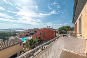 a view from the balcony of a house with a swimming pool at B 104 Puntavilla Mare in La Maddalena
