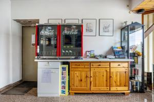 a soda machine sitting on top of a counter at Ferienwohnung-4you in Sigmarszell