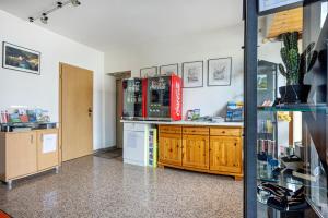 a room with a kitchen with a counter and a counter at Ferienwohnung-4you in Sigmarszell