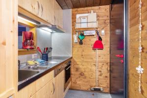 a kitchen with a sink and a counter top at Ferienwohnung Herzogenhorn in Bernau im Schwarzwald +19 photos