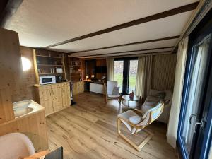 a room with a kitchen and a living room at Ferienwohnung Herzogenhorn in Bernau im Schwarzwald