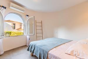a bedroom with a bed and an open window at El Refugio - Quite and Spacious in Benissa +21 photos