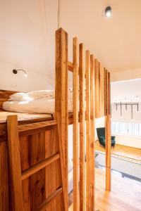 a group of wooden bunk beds in a room at Innerbachlerhof - Laugen in Postal +25 photos