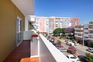 a balcony of a building with a view of a city at Justo's House in Faro