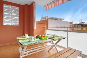 a table on top of a balcony with a window at Casa Pera in Xilxes