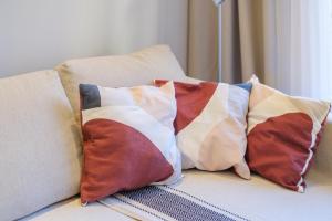 a group of pillows sitting on a couch at Appartement Sea View in Nice