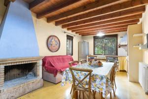 a living room with a table and a fireplace at La Carrasca - Limón in Catral