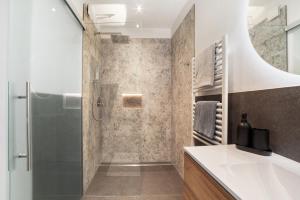 a bathroom with a shower and a sink at Appartment Riffl Anna in Rifiano +26 photos