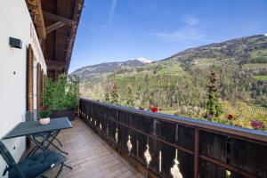 a balcony with a view of the mountains at Appartment Riffl Anna in Rifiano