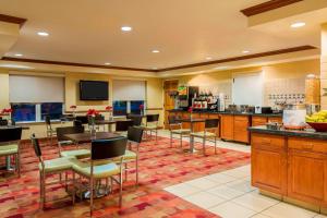 a large room with tables and chairs in a kitchen at TownePlace Suites by Marriott Springfield in Springfield
