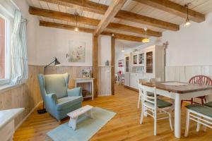 a kitchen and dining room with a table and chairs at Grüner-Seppel in Rodalben +20 photos