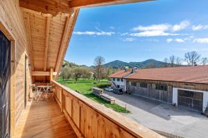 a view from the balcony of a wooden house at Wohnung Brauneck in Gaißach