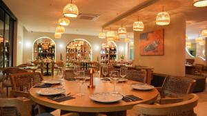 a dining room with a table and chairs at Athena Premium Suites in Erdemli