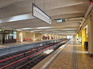 an empty subway station with a train platform and a train station at 85th Pool View Studio in Popeşti-Leordeni